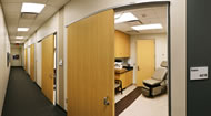 The clinic’s design includes a staging area where physicians and clinic staff can review patient records or consult with others in private. Each exam room has two entrances—one for patient use and one for clinic staff.